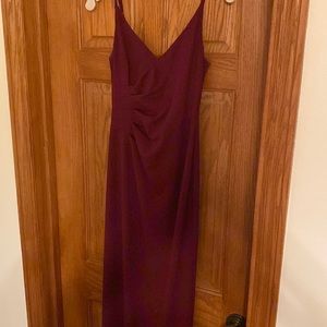 This is a NWT long, wine colored dress from David’s Bridal.  Size 0.